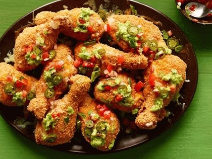 Foto Hähnchenschenkel paniert mit Mais-Chips und Käse