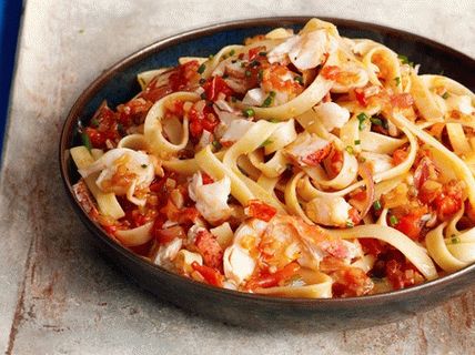 Photo Fettuccine Pasta mit Langusten, Tomaten und Safran