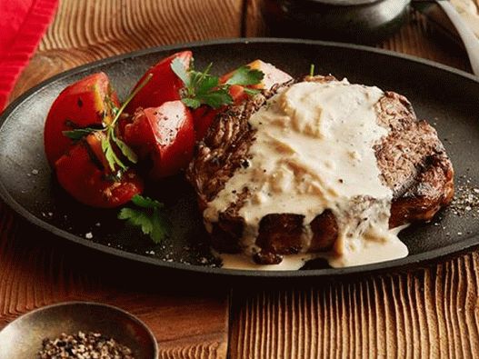 Photo Rib Eye Steak mit Zwiebel-Blauschimmelkäse-Sauce